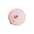 Pink silicone lid on a white background. 