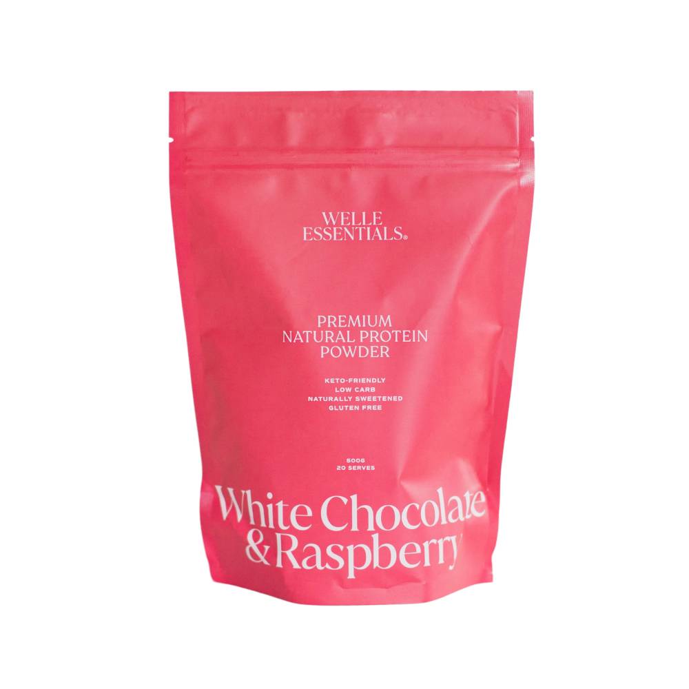 Pink protein powder bag against white background.